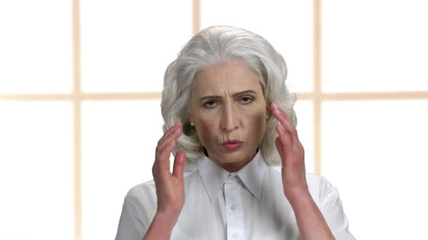 Close up upset mature woman suffering from headache. - Metraje, vídeo