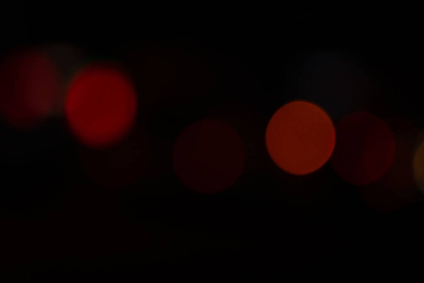 Bright round lights on black background - Foto, Imagen