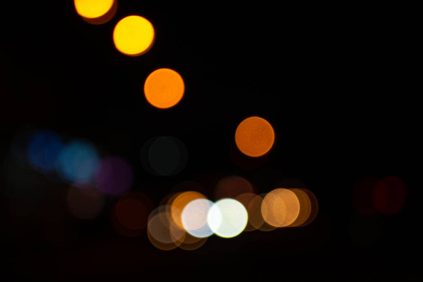 Bright round lights on black background - Fotó, kép