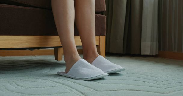 Woman wear slipper at hotel room - Фото, изображение