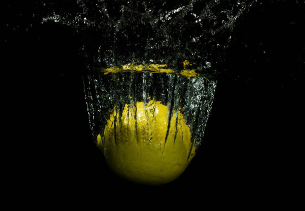 splash lemon with black background - Photo, Image
