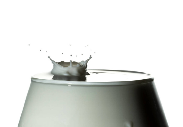 Drop of frozen milk falling and making a realistic and natural splash. - Photo, Image