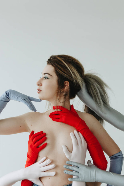 Sexy woman wearing gloves on white background - Zdjęcie, obraz