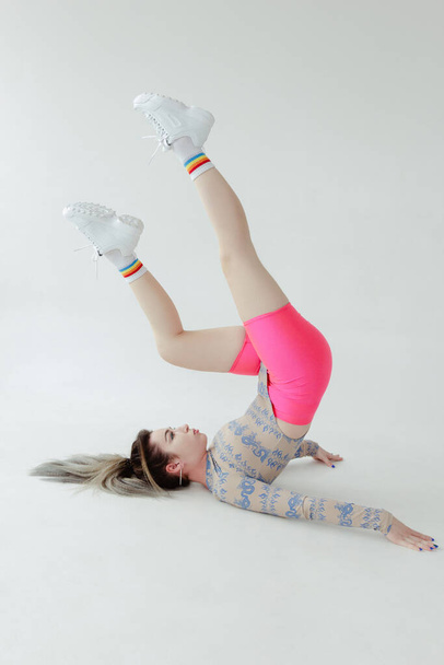 Beautiful woman doing aerobics on white background - Photo, image