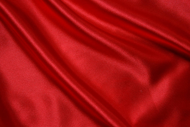 Piros ruha hullámok háttér textúra. - Fotó, kép