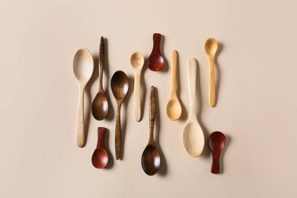 Different wooden spoons on light background - Zdjęcie, obraz