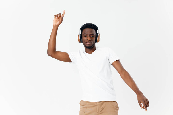 man african appearance headphones gesturing with hands music - Photo, Image