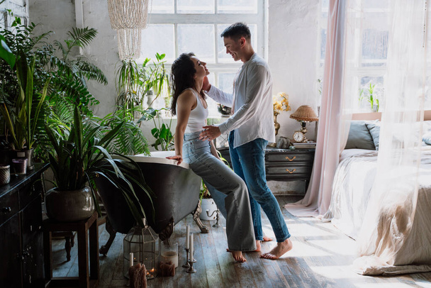 young couple spending time in their beautiful countryside house. Romantic lifestyle moments - Fotoğraf, Görsel