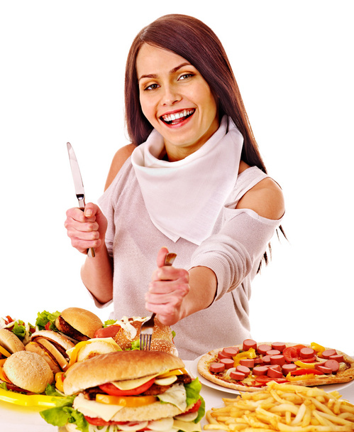 Žena jíst rychlé občerstvení. - Fotografie, Obrázek