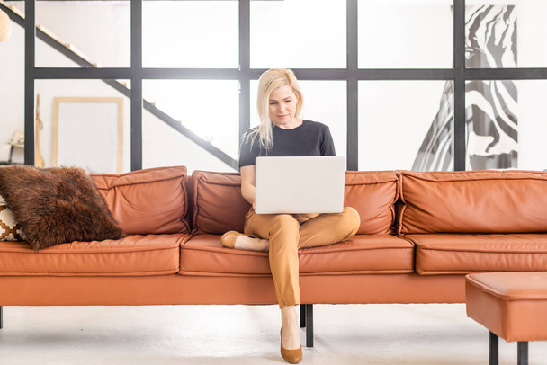 Hipster woman use Laptop huge Loft Studio. Student Researching Process Work. Young Business Woman Working Creative Startup modern Office. Analyze market stock, new strategy - 写真・画像