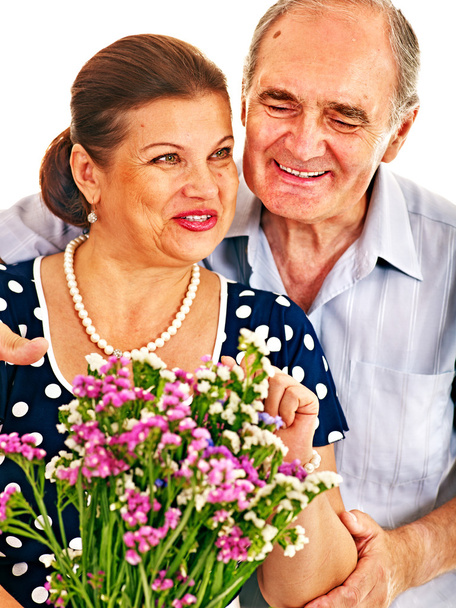 Old couple holding flower. - Photo, Image
