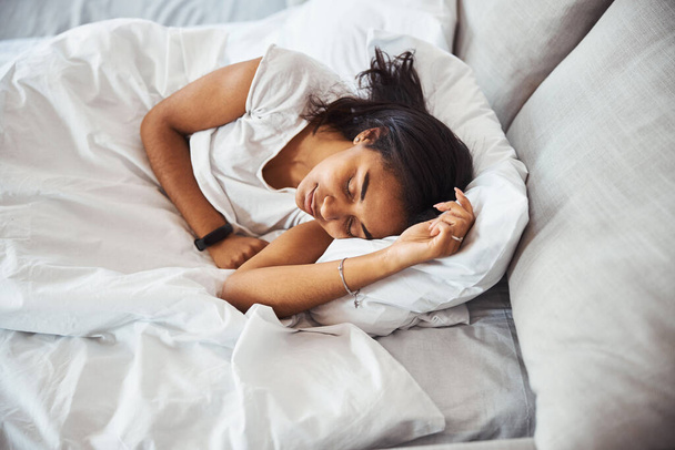 Charming young woman sleeping in bed at home - Photo, Image
