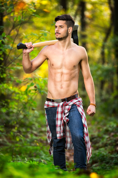Muscled man with axe  - 写真・画像