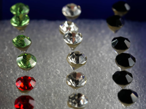 Boxes of different colors with lots of jewelry. Selective focus. Macro. - Photo, Image