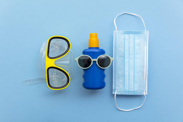 Summer holiday protective face mask with scuba mask and suncream - Fotoğraf, Görsel