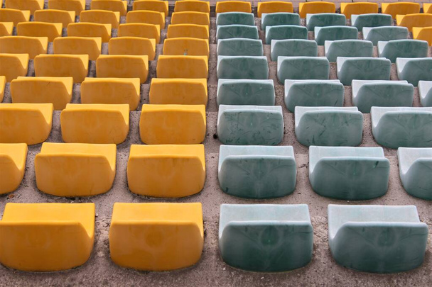 Blue and yellow plastic seats - Photo, Image