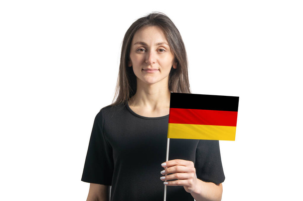 Happy young white girl holding Germany flag isolated on a white background. - Fotoğraf, Görsel