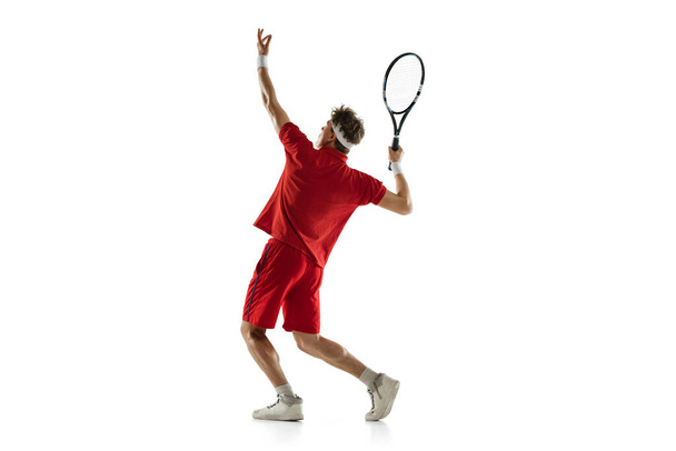 One Caucasian man, professional tennis player isolated on white background. - Φωτογραφία, εικόνα