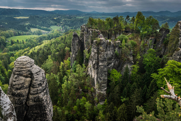 The Bastei is a rock formation towering above the Elbe River in the Elbe Sandstone Mountains of Germany, Dreden, Saxony - 写真・画像