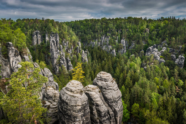 The Bastei is a rock formation towering above the Elbe River in the Elbe Sandstone Mountains of Germany, Dreden, Saxony - Фото, изображение
