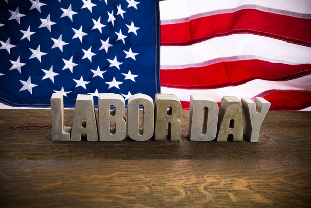 Happy Labor Day banner. USA flag and letters on rustic wooden background. - Valokuva, kuva