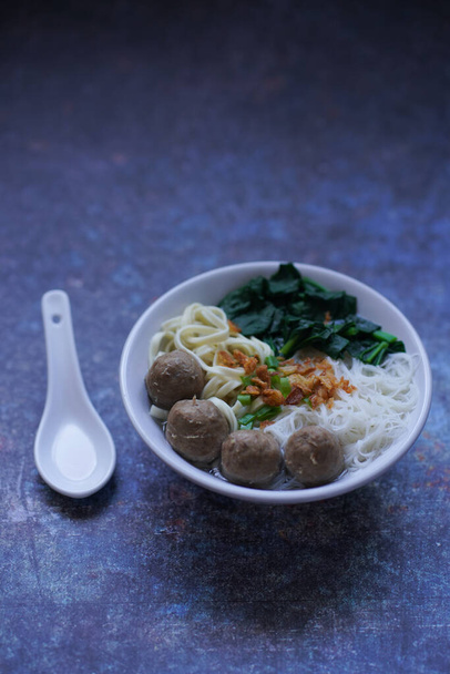 Bakso is Indonesian Meatballs soup on a white bowl, selective focus - Photo, Image