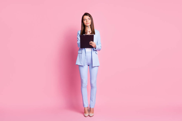 Full size photo of cute lady stand look empty space write wear business suit stilettos isolated on pink color background - Photo, Image