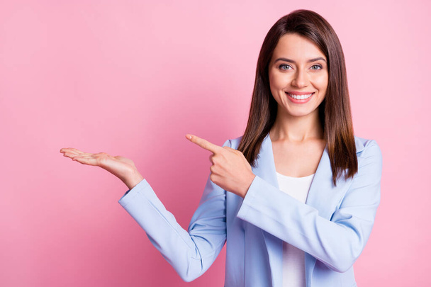 Photo of young attractive cheerful good mood boss woman hold hand pointing finger in copyspace isolated on pink color background - Φωτογραφία, εικόνα