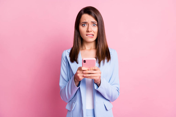 Photo of young woman nervous panic fail mistake dislike use smartphone isolated over pastel color background - Fotografie, Obrázek
