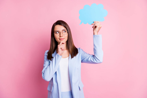 Photo of young attractive woman hold paper mind cloud think thoughtful pensive hand touch chin isolated over pink color background - Valokuva, kuva