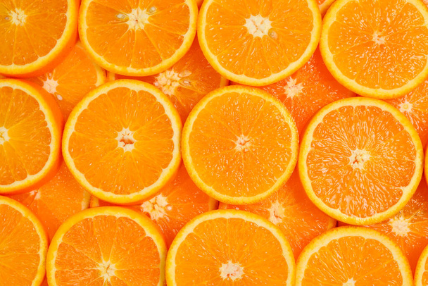 Orangenscheiben als Hintergrund, Draufsicht.  - Foto, Bild