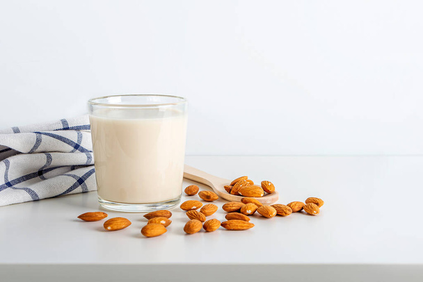 Cooked nuts vegetable drink. Almonds milk in glass. Homemade food concept. Plant based organic veggie milk, lactose free. copy space for text. Healthy breakfast - 写真・画像
