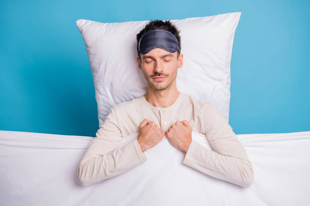 Top above high angle view portrait of nice calm guy sleeping on soft bed linen isolated over bright blue color background - Foto, Imagem