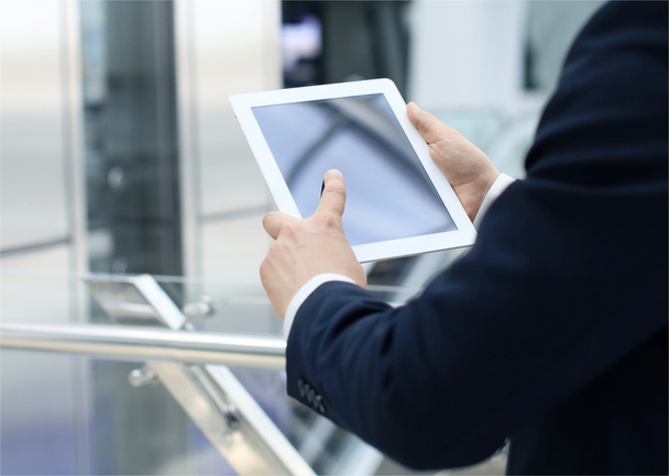 Midsection of businessman using digital tablet in office - Fotoğraf, Görsel