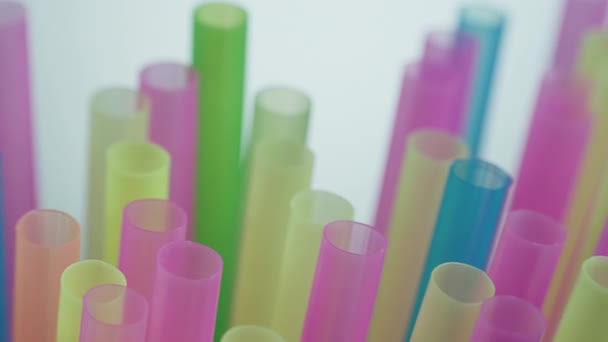 Cocktail Multicolored plastic tubes on a dark background ,camera motion - Footage, Video
