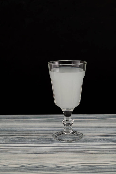 Raki - Turkish or Greek alcoholic drink, distilled from grapes and flavored with anise, when mixed with water becomes milky white. - Photo, Image