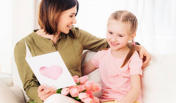 Mom likes opening daughters presents - 写真・画像