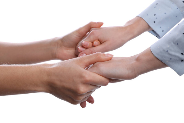 Women holding hands on white background, closeup - Photo, Image