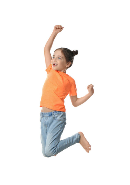Cute little girl jumping on white background - 写真・画像