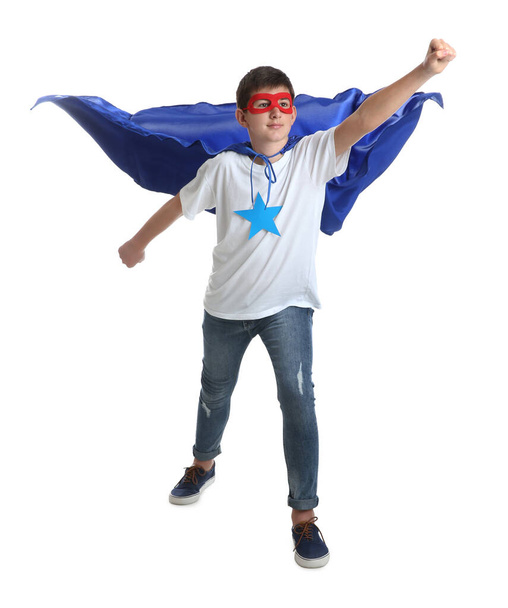 Teenage boy in superhero costume on white background - Foto, Bild