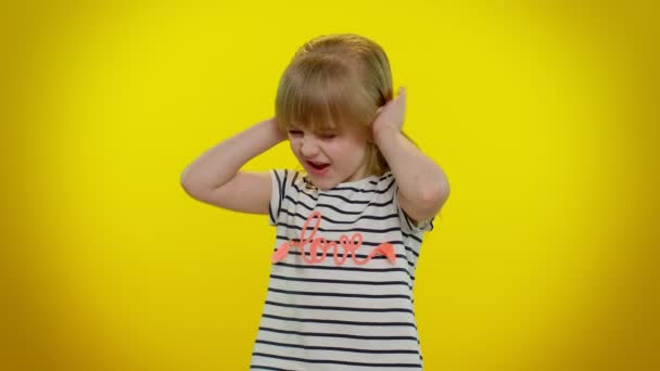 Frustrated annoyed irritated kid child girl covering ears and gesturing no, avoiding advice, noise - Footage, Video