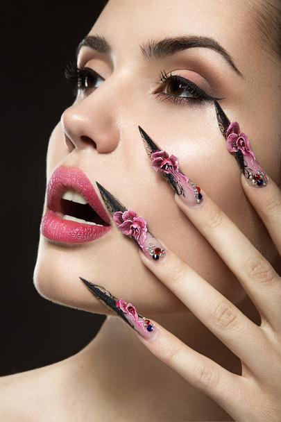 Beautiful girl with long nails and sensual lips - Fotografie, Obrázek