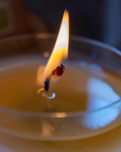 A closeup shot of a burning candle - Фото, изображение