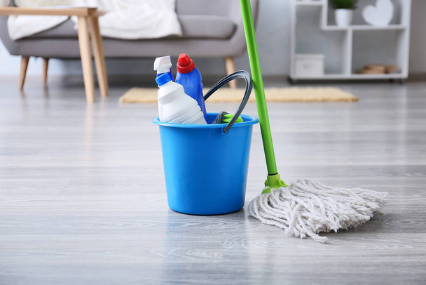 Set of cleaning supplies with mop in room - Photo, Image