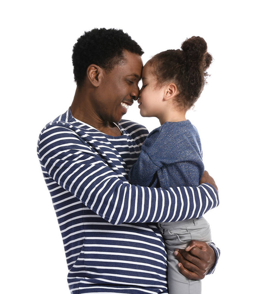 Portrait of happy African-American father and his little daughter on white background - Photo, Image