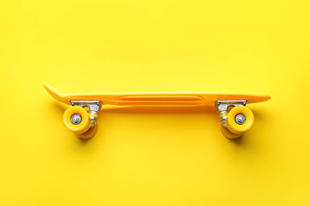 Modern skateboard on color background - Photo, Image