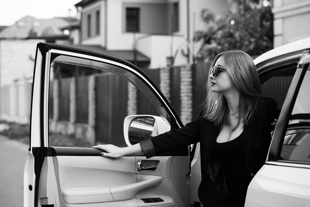 Business woman in a car, auto lady concept. Stylish lady sit in automobile - Photo, Image