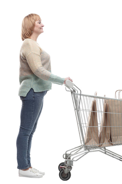 in full growth. attractive casual woman with shopping cart . - Fotoğraf, Görsel