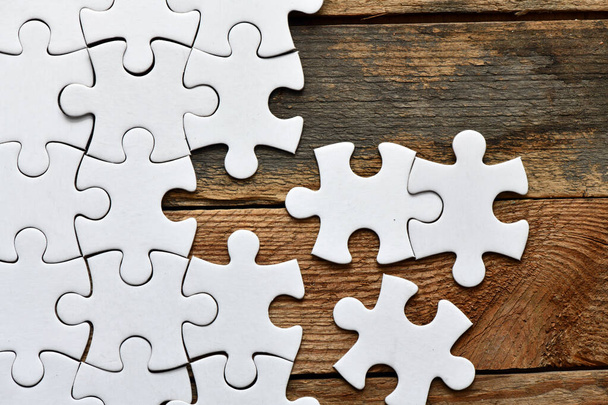 Assembling jigsaw puzzle pieces. Abstract background. - Foto, Imagem