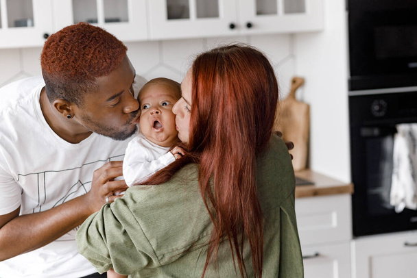 portrait of happy  family with baby boy  at home - Foto, Imagen